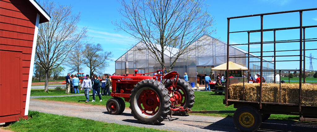 Tractor near a greenhouse