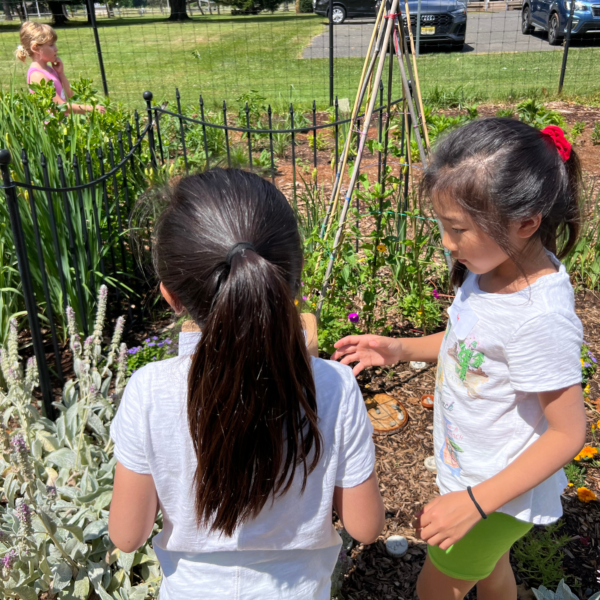 Two children peruse the scented and textured plants at the Rutgers Master Gardener Sensory Garden